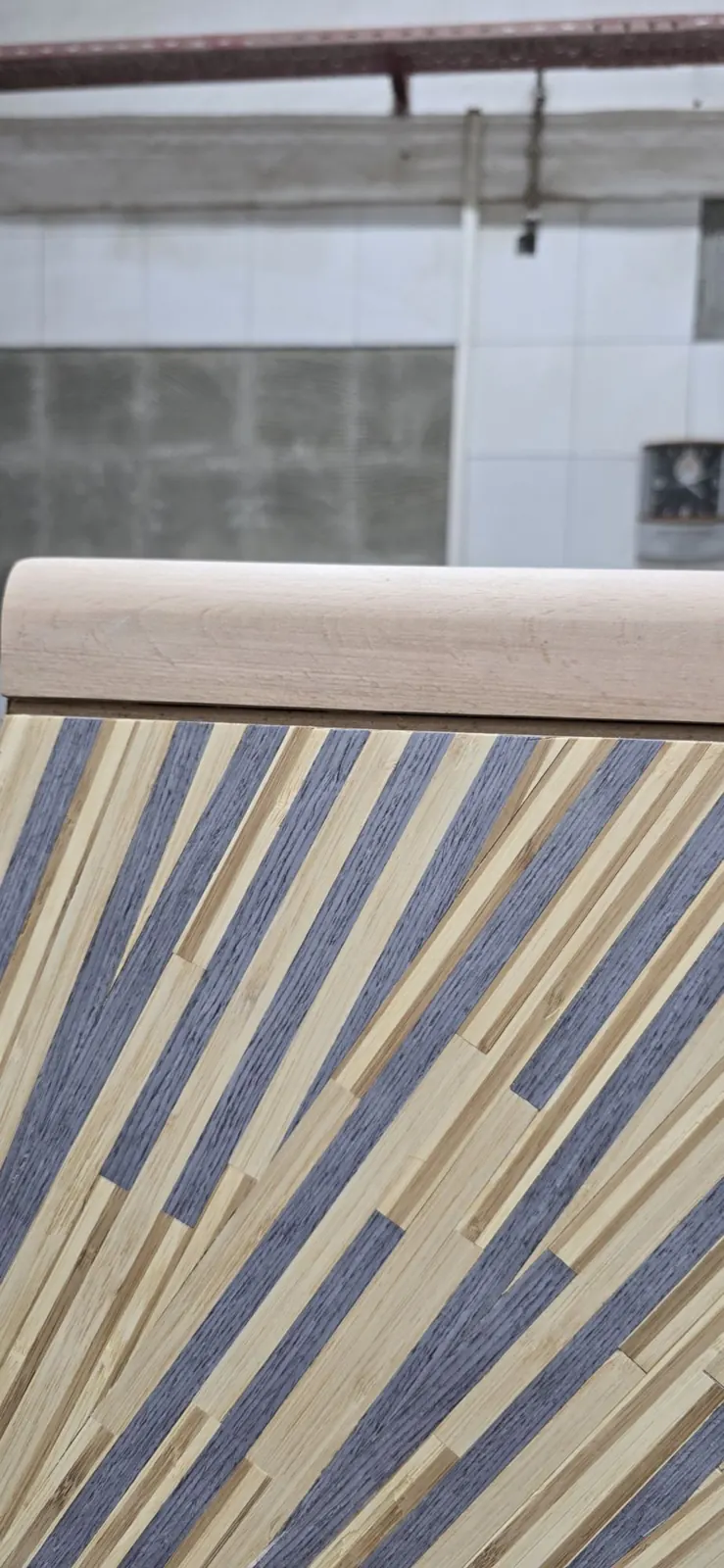 Inlaid panel sample: dark and light timber strips set on the diagonal